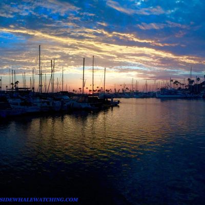 a boat is docked next to a body of water
