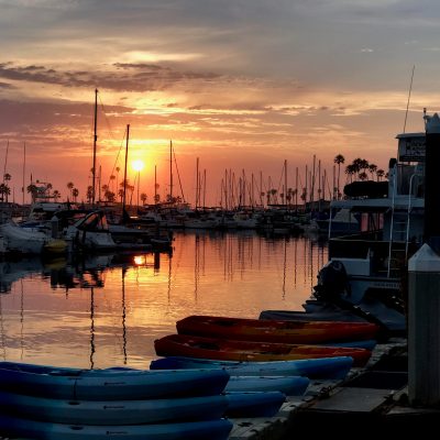 a boat docked at sunset