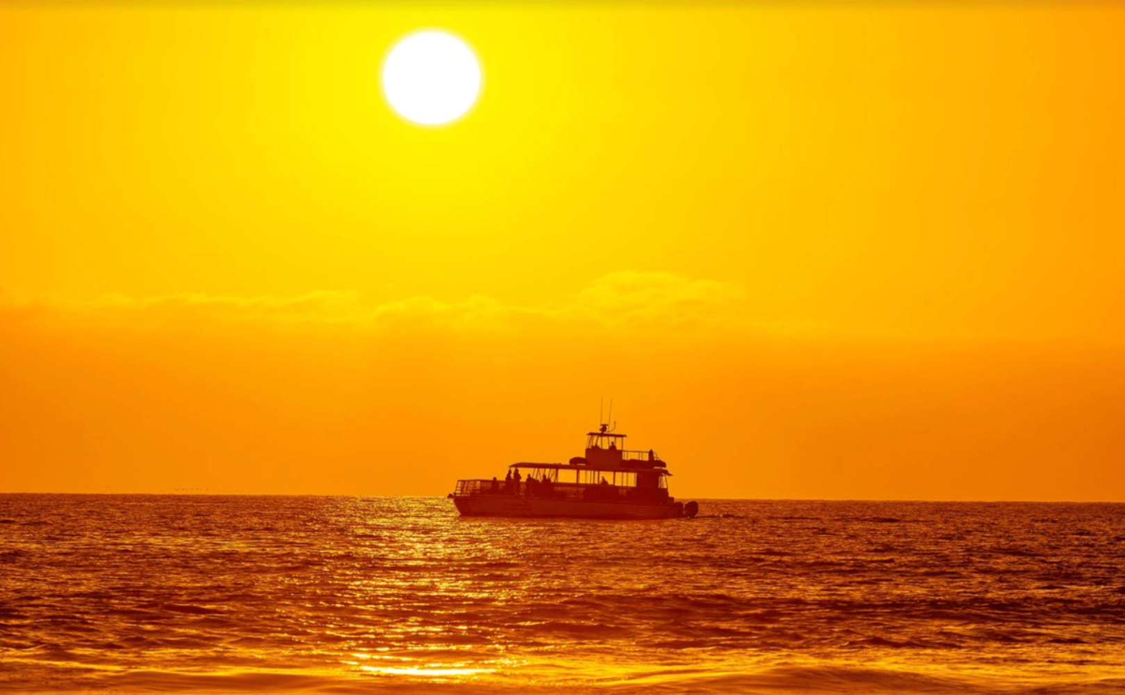 a sunset over a body of water