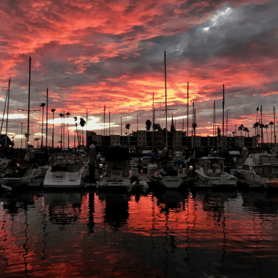 a boat is docked next to a body of water
