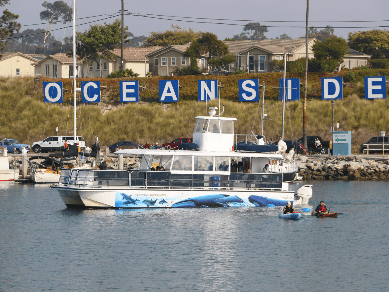 a group of people on a boat in the water