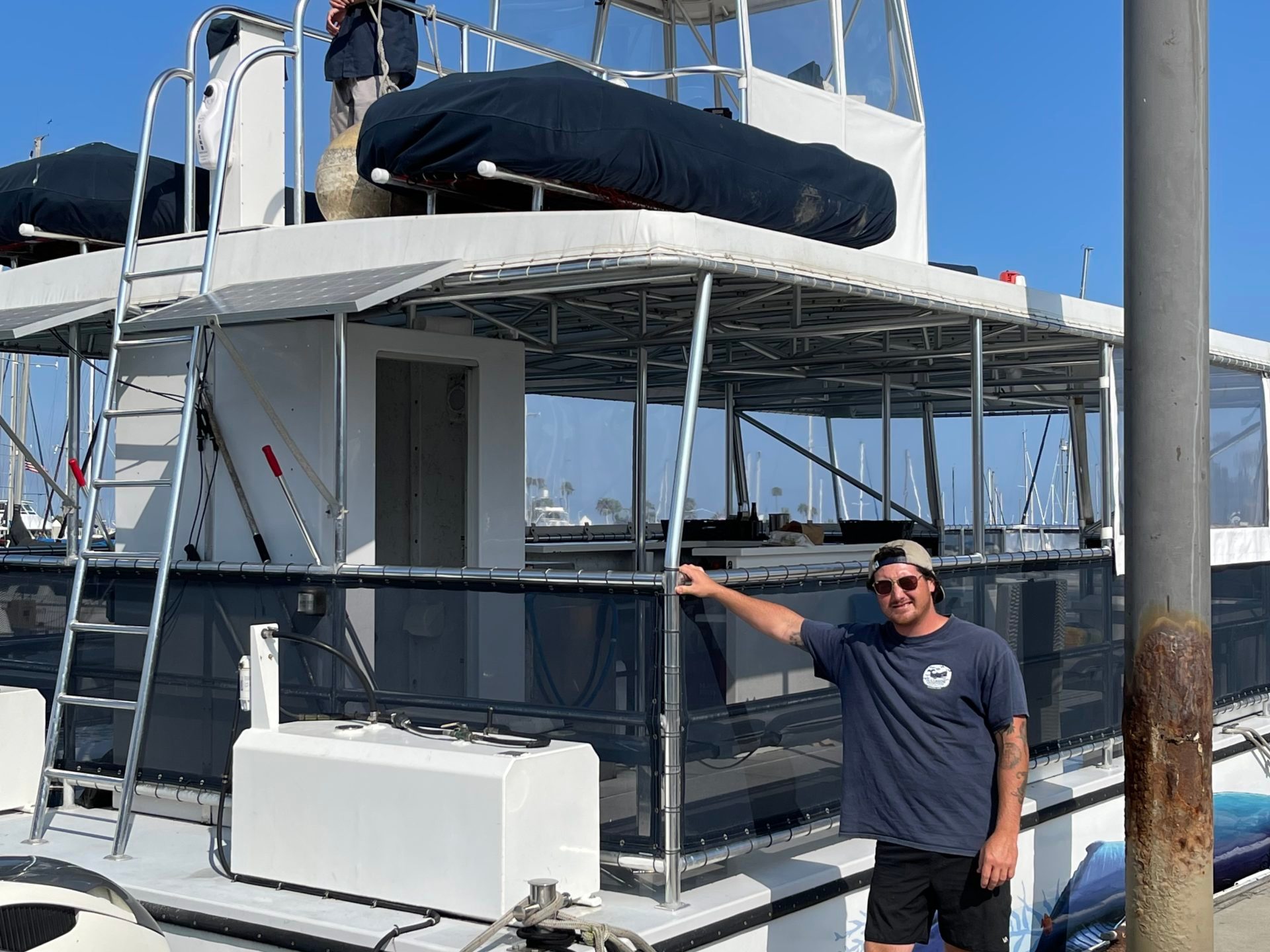a man standing in front of a boat