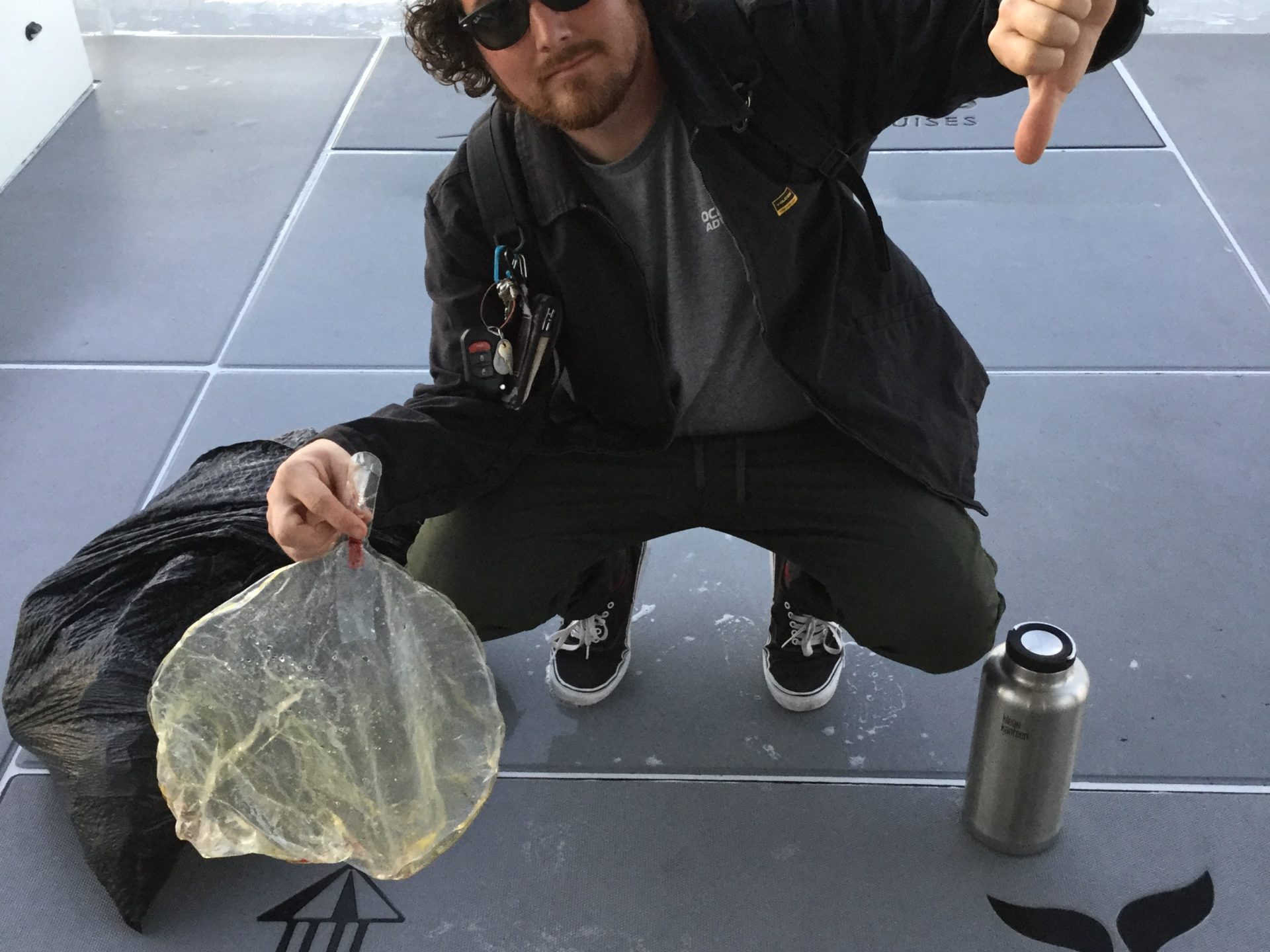 a person sitting in a parking lot
