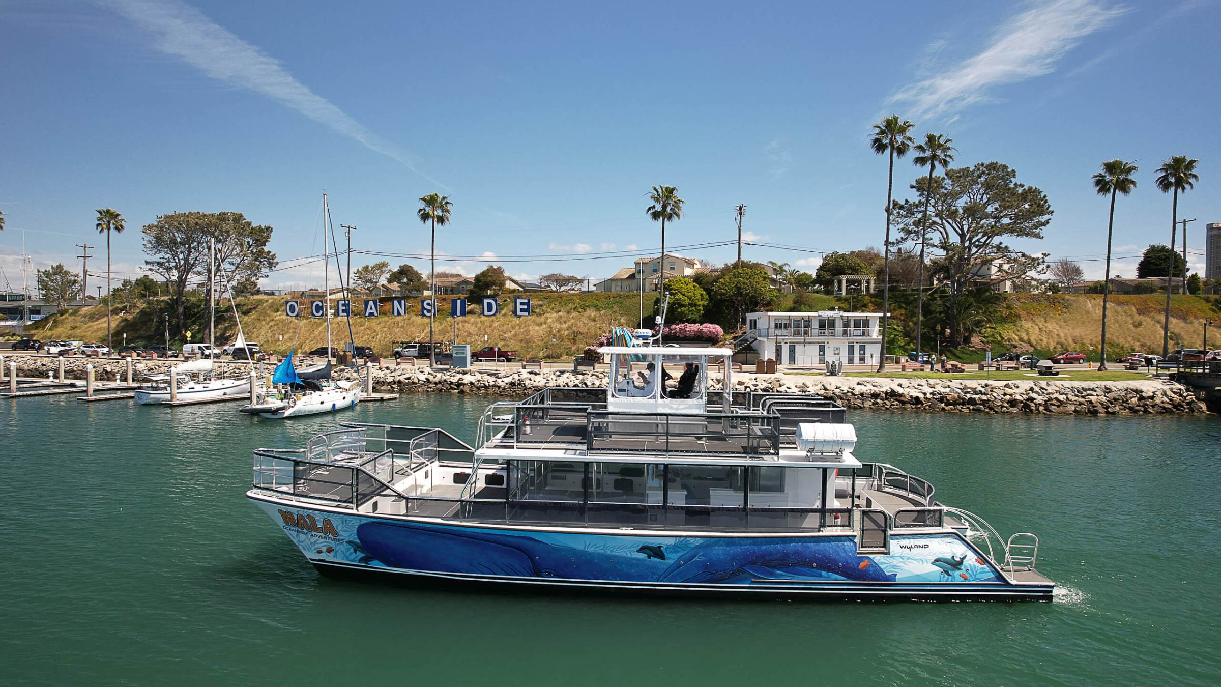 a boat is docked next to a body of water