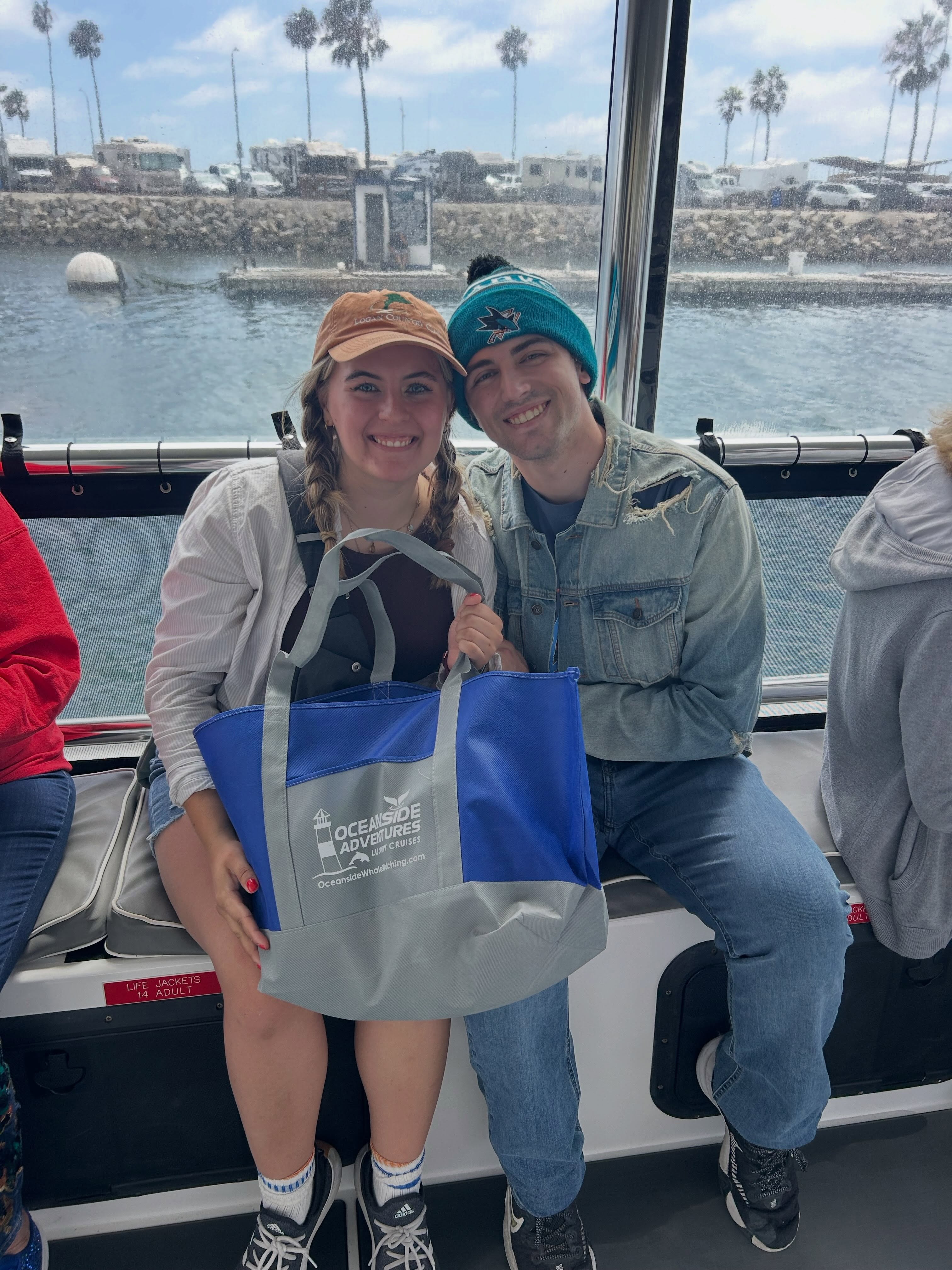 Happy guests aboard an Oceanside Adventures whale watching cruise in Oceanside Harbor